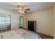 Bedroom view with ceiling fan, mirror closet, and open door to other rooms at 1737 Fontaine Dr, Jonesboro, GA 30236