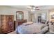 Bedroom with hardwood floors, ceiling fan and a large mirror closet at 1737 Fontaine Dr, Jonesboro, GA 30236