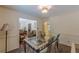 Classic dining room with a glass-top table, ornate chairs, and views into the adjacent living space at 1737 Fontaine Dr, Jonesboro, GA 30236
