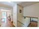 Bright hallway with wood floors, stairs and a view into the living room at 1737 Fontaine Dr, Jonesboro, GA 30236
