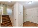 Home's staircase and entrance hall with classic wood flooring and white trim at 1737 Fontaine Dr, Jonesboro, GA 30236