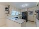 Bright kitchen features white cabinets, black appliances, and a window over the sink at 1737 Fontaine Dr, Jonesboro, GA 30236