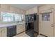 The kitchen features white cabinets and a black refrigerator at 1737 Fontaine Dr, Jonesboro, GA 30236