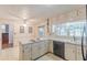 Bright kitchen area featuring white cabinets, stainless steel appliances, and natural light at 1737 Fontaine Dr, Jonesboro, GA 30236