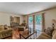 Charming living room features hardwood floors, access to the deck, and a cozy atmosphere at 1737 Fontaine Dr, Jonesboro, GA 30236