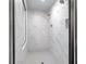 New walk-in shower features marble tile, niche, and glass door at 197 Haverling Pass, Hampton, GA 30228