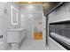 Bright bathroom showcasing marble tiling, a modern vanity, fireplace, and doorway access at 1060 Mcdaniel Sw St, Atlanta, GA 30310