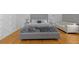 Bedroom with hardwood floors, paneled walls, and gray upholstered bed at 1060 Mcdaniel Sw St, Atlanta, GA 30310