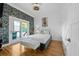 Cozy bedroom with stone accent wall and bright white shiplap at 1060 Mcdaniel Sw St, Atlanta, GA 30310