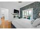 Beautiful bedroom featuring a stone accent wall, fireplace, and stylish decor at 1060 Mcdaniel Sw St, Atlanta, GA 30310