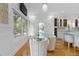 Bright dining room featuring an open floor plan to the kitchen, hardwood floors, and an abundance of natural light at 1060 Mcdaniel Sw St, Atlanta, GA 30310