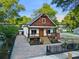 Charming craftsman home with a welcoming front porch, beautiful landscaping, and fenced yard at 1060 Mcdaniel Sw St, Atlanta, GA 30310