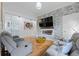 Spacious living room featuring a modern fireplace, hardwood floors, and an open floor plan with lots of light at 1060 Mcdaniel Sw St, Atlanta, GA 30310