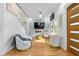 Bright living room boasts modern fireplace, sleek hardwood floors, and plenty of natural light from large windows at 1060 Mcdaniel Sw St, Atlanta, GA 30310