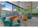 Inviting sunroom with panoramic windows, modern seating, and natural light at 1060 Mcdaniel Sw St, Atlanta, GA 30310