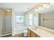 Bright bathroom with tub, separate shower, and wood vanity at 7567 Waverly Loop, Fairburn, GA 30213