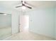 Bedroom view showing the fan, mirrored closet and doorway leading to another room at 7567 Waverly Loop, Fairburn, GA 30213