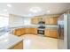 Bright kitchen boasts updated appliances, stone countertops, and plenty of cabinet space at 7567 Waverly Loop, Fairburn, GA 30213
