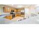 Kitchen with stainless steel appliances, granite counters and wood cabinets at 7567 Waverly Loop, Fairburn, GA 30213