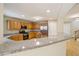 Open kitchen with spacious countertops and stainless steel appliances, with a breakfast bar at 7567 Waverly Loop, Fairburn, GA 30213