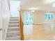 Spacious room with wood floors and light-filled sliding doors to the backyard at 7567 Waverly Loop, Fairburn, GA 30213