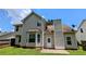 Backyard view of home with back patio and wooded lot at 3679 Waldrop Cliff Ln, Decatur, GA 30034