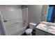 Bathroom featuring a shower-tub combo, toilet, and vanity with sink at 3679 Waldrop Cliff Ln, Decatur, GA 30034