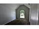 Bedroom featuring an arched window and carpeted floor at 3679 Waldrop Cliff Ln, Decatur, GA 30034