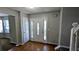 Welcoming entryway with hardwood floors, sidelights, and a decorative front door, offering a bright and inviting entrance at 3679 Waldrop Cliff Ln, Decatur, GA 30034