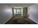 Cozy living room with a large bay window allowing natural light and plush carpeting for a comfortable atmosphere at 3679 Waldrop Cliff Ln, Decatur, GA 30034