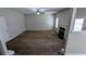 Large living room featuring plush carpeting, a fireplace, neutral paint, and a ceiling fan for a cozy gathering area at 3679 Waldrop Cliff Ln, Decatur, GA 30034