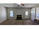 Spacious living room with plush carpeting, a fireplace, neutral paint, and easy access to the outdoors at 3679 Waldrop Cliff Ln, Decatur, GA 30034