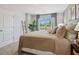 Bedroom with a large window and closet at 1402 Sweetshrub Pl # 32, Atlanta, GA 30318