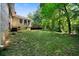 Large, green backyard with mature trees at 5070 Maryland Nw Dr, Acworth, GA 30101