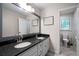 Elegant bathroom with dual sinks, granite countertop, and a large mirror at 5070 Maryland Nw Dr, Acworth, GA 30101