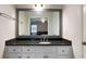 Bathroom featuring a vanity with granite countertops and framed mirror at 5070 Maryland Nw Dr, Acworth, GA 30101