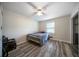 Cozy bedroom with a ceiling fan and wood floors, perfect for relaxation at 5070 Maryland Nw Dr, Acworth, GA 30101
