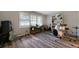 Bonus room with gray tone flooring, a window, and a built-in bookshelf at 5070 Maryland Nw Dr, Acworth, GA 30101