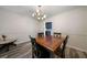 Warm dining room featuring hardwood floors and modern lighting at 5070 Maryland Nw Dr, Acworth, GA 30101