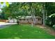 Charming single-story home with a well-maintained lawn and a two-car garage at 5070 Maryland Nw Dr, Acworth, GA 30101