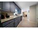 Remodeled kitchen featuring blue cabinets, granite countertops, and stainless steel appliances at 5070 Maryland Nw Dr, Acworth, GA 30101