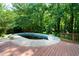 Backyard pool area with deck, offers a refreshing outdoor retreat at 5070 Maryland Nw Dr, Acworth, GA 30101