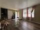 Inviting living room with hardwood floors, neutral paint, and ample natural light at 2275 Chestnut Log Loop, Lithia Springs, GA 30122
