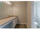 Bathroom featuring a vanity with a sink and a toilet in a separate area at 70 Trinity Lane, Covington, GA 30016