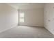 Bedroom features plush carpeting, neutral walls, window and closet at 70 Trinity Lane, Covington, GA 30016