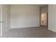 Bedroom with neutral walls, plush carpet and open doorway to bath at 70 Trinity Lane, Covington, GA 30016