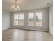 Dining room featuring a chandelier and views of the backyard at 70 Trinity Lane, Covington, GA 30016