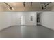 Clean two car garage featuring an exit door to the home at 70 Trinity Lane, Covington, GA 30016
