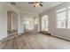 Open floor plan features arched doorways and wood-style floors at 70 Trinity Lane, Covington, GA 30016