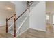 Staircase with carpeted steps and white railings leads to upper floor at 70 Trinity Lane, Covington, GA 30016